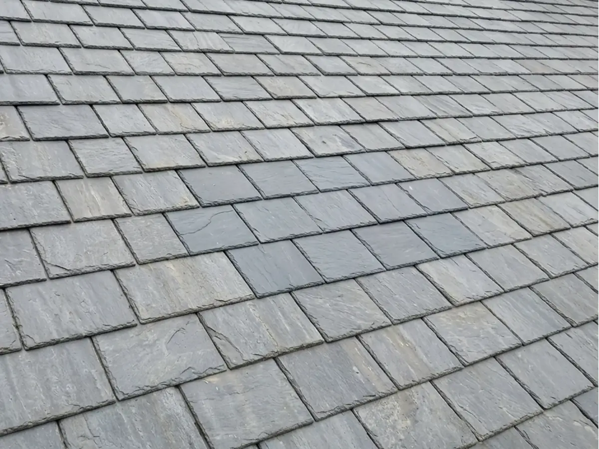 Natural slate roof slope with even, straight courses
