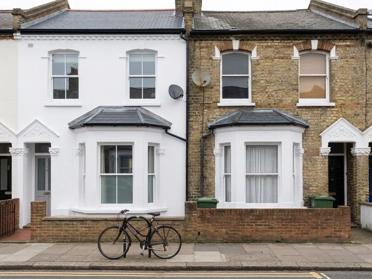 Slate roofs over the bay windows of two terraced houses